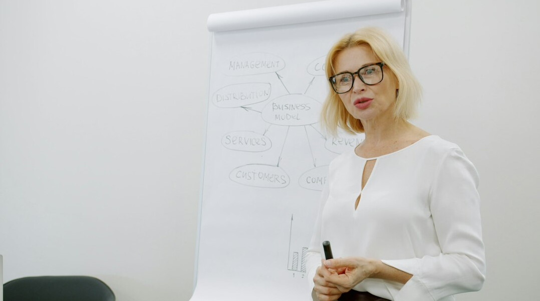 woman gesturing during presentation